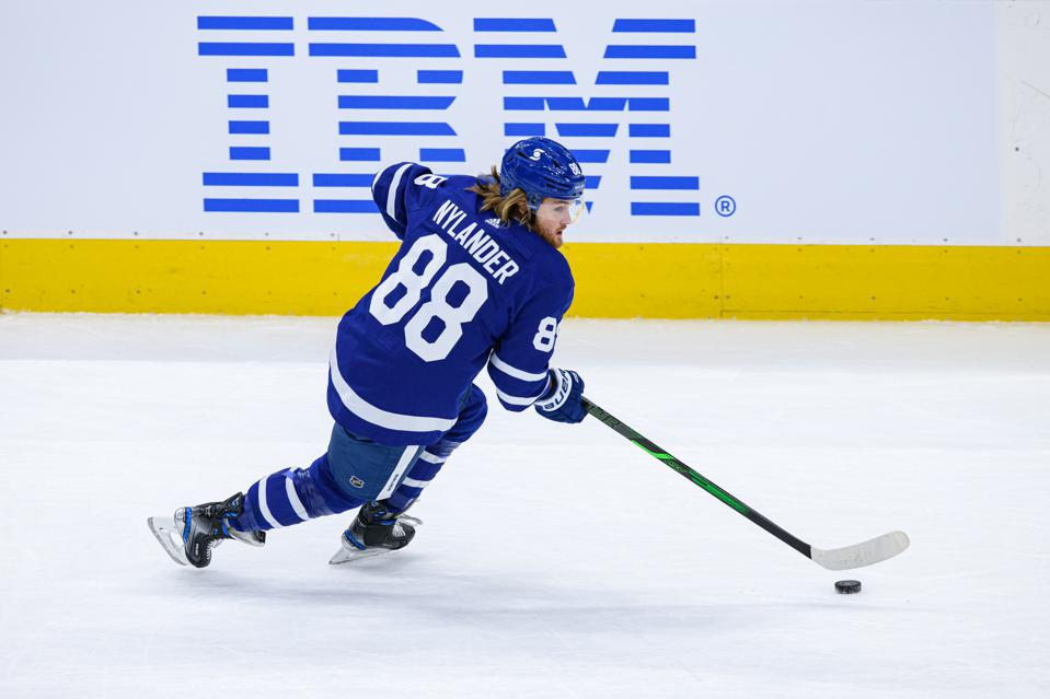 NHL: FEB 04 Canucks at Maple Leafs skater speeds past an IBM logo.